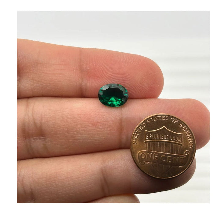 Lab Created Emerald Oval Concave Cut 9x7mm